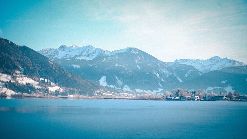 Lake Zell in winter below the snow-capped mountains, Zell am See