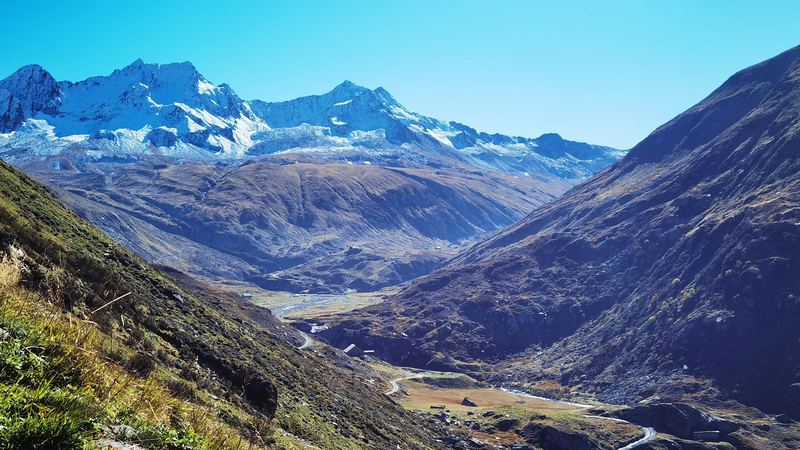 The Urseren valley at Andermatt below snow-topped mountains