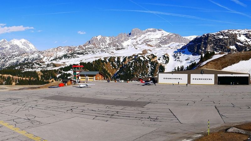 The Courchevel altiport with its control tower and hangars below snowy mountains