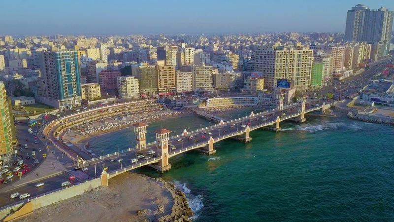 Stanley Bridge and its towers crossing the bay on the Corniche in Alexandria, above a green Mediterranean