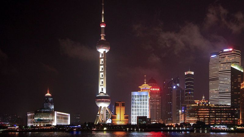 The Oriental Pearl Tower and Pudong at night, across the Huangpu