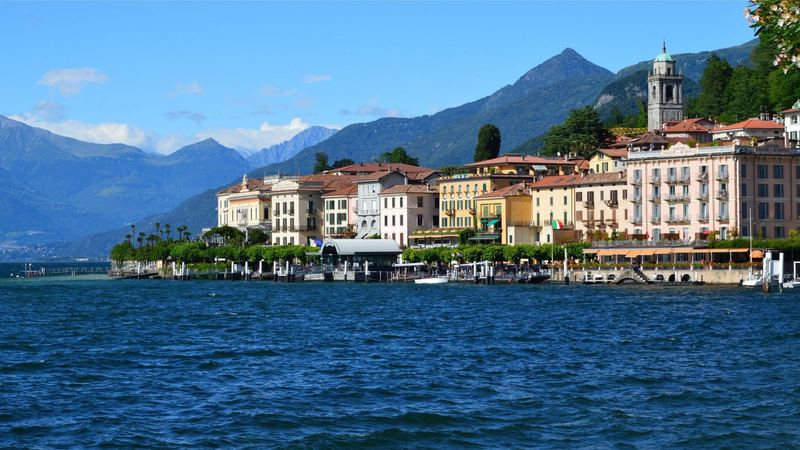 The pastel hotels and waterfront of Bellagio on Lake Como below the mountains