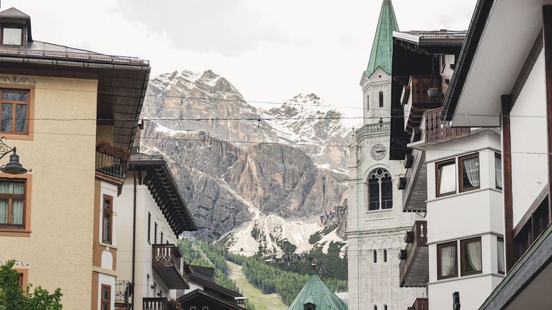 The bell tower and the Tofane above the old centre of Cortina d'Ampezzo