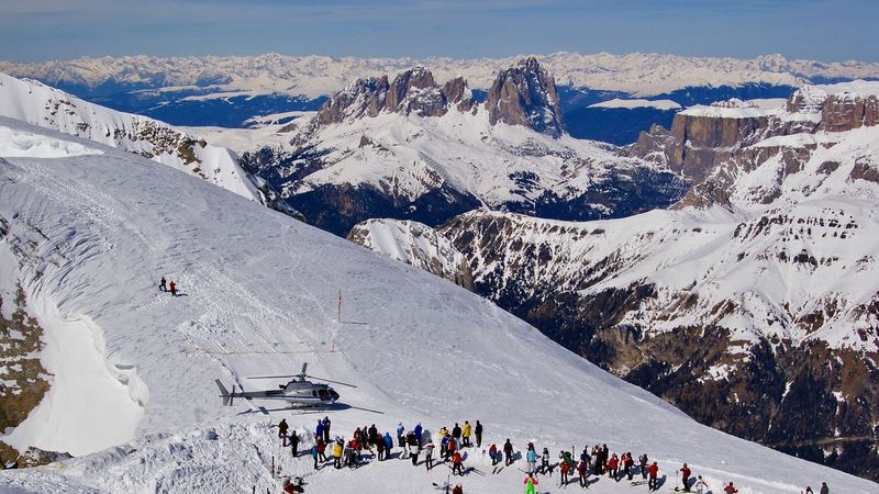 The Marmolada and its glacier, the Queen of the Dolomites, above larches turned gold in autumn