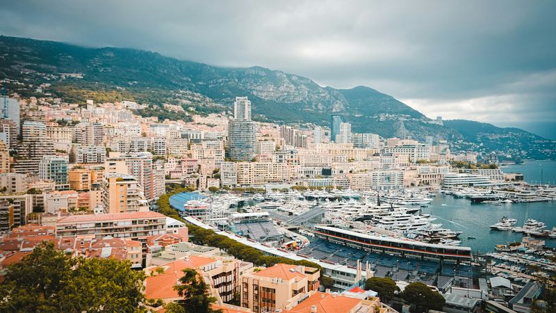 Monte-Carlo and its harbour from above, the mountains behind