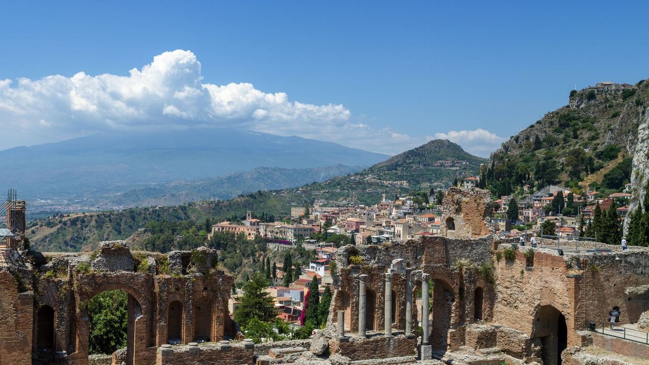 The ancient theatre of Taormina, with Etna beyond