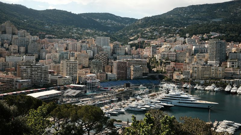 Monte-Carlo and Port Hercule below the mountains, seen through the pines from the Rock