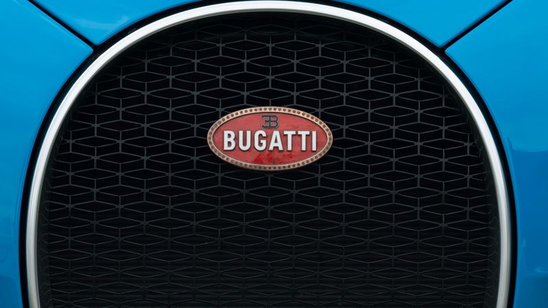 The horseshoe grille and red badge of a blue Bugatti Chiron