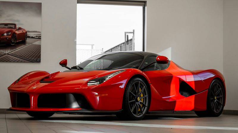 A red LaFerrari in a showroom