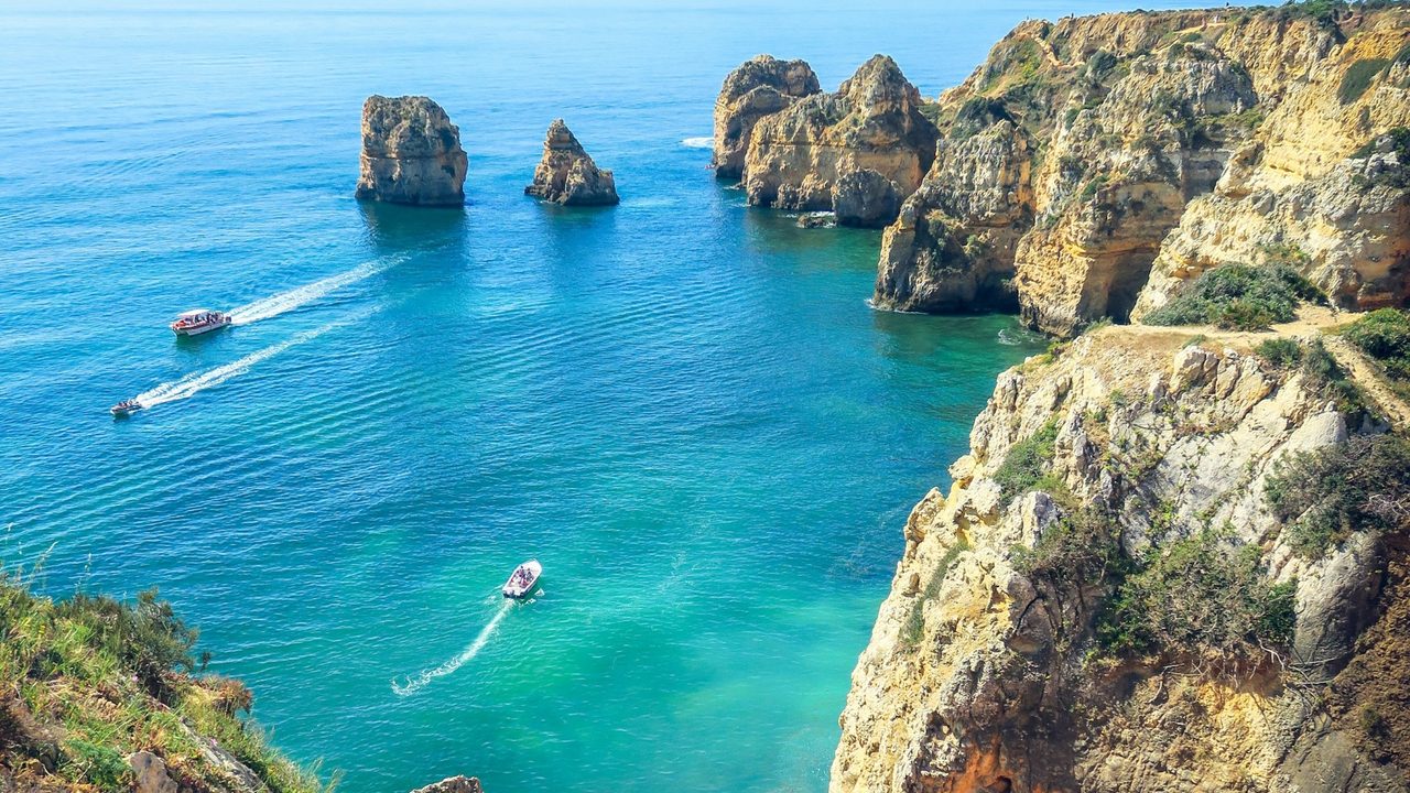 The golden cliffs and sea stacks of Ponta da Piedade above turquoise water