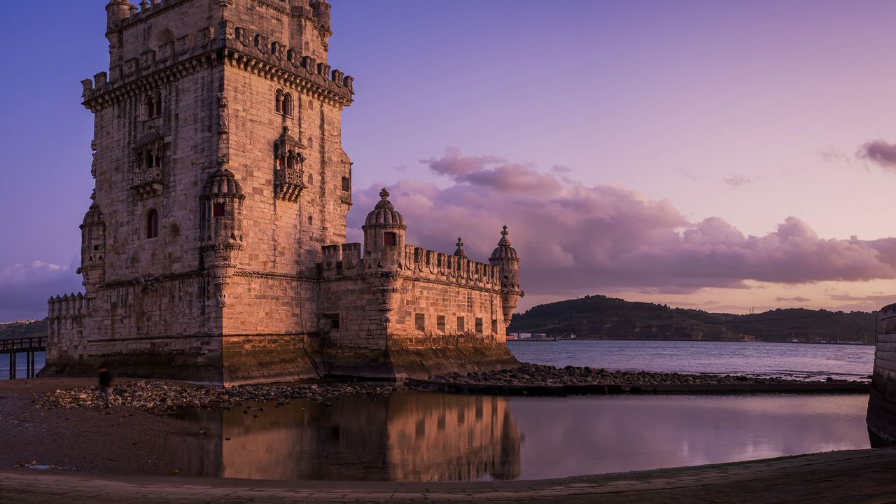 Belém Tower on the Tagus at sunset, reflected in the water