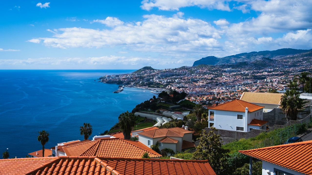 Red-tiled villas above Funchal Bay and the Atlantic, Madeira