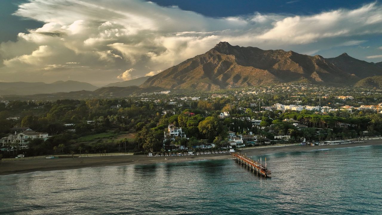 La Concha mountain above the Golden Mile and its pier, Marbella