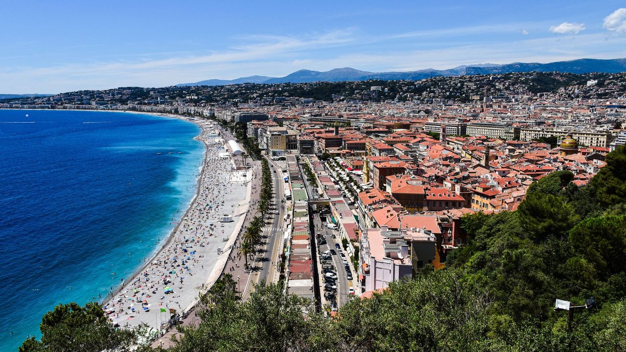 The Baie des Anges, the Promenade des Anglais and the red roofs of old Nice from Castle Hill