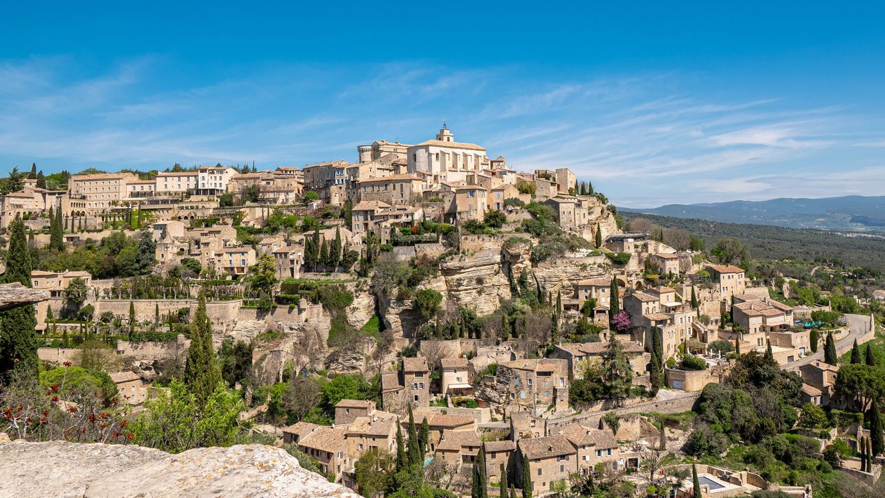 The hilltop village of Gordes, its château and church above the Luberon valley