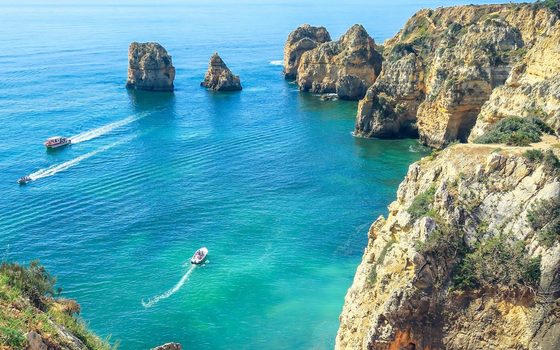 Golden cliffs and sea stacks on the Algarve coast