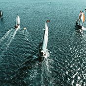 Sailing yachts racing at sea, seen from above