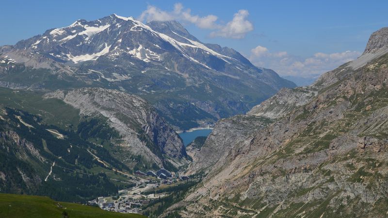 The Tarentaise valley in summer, its lake and village below a glaciered peak